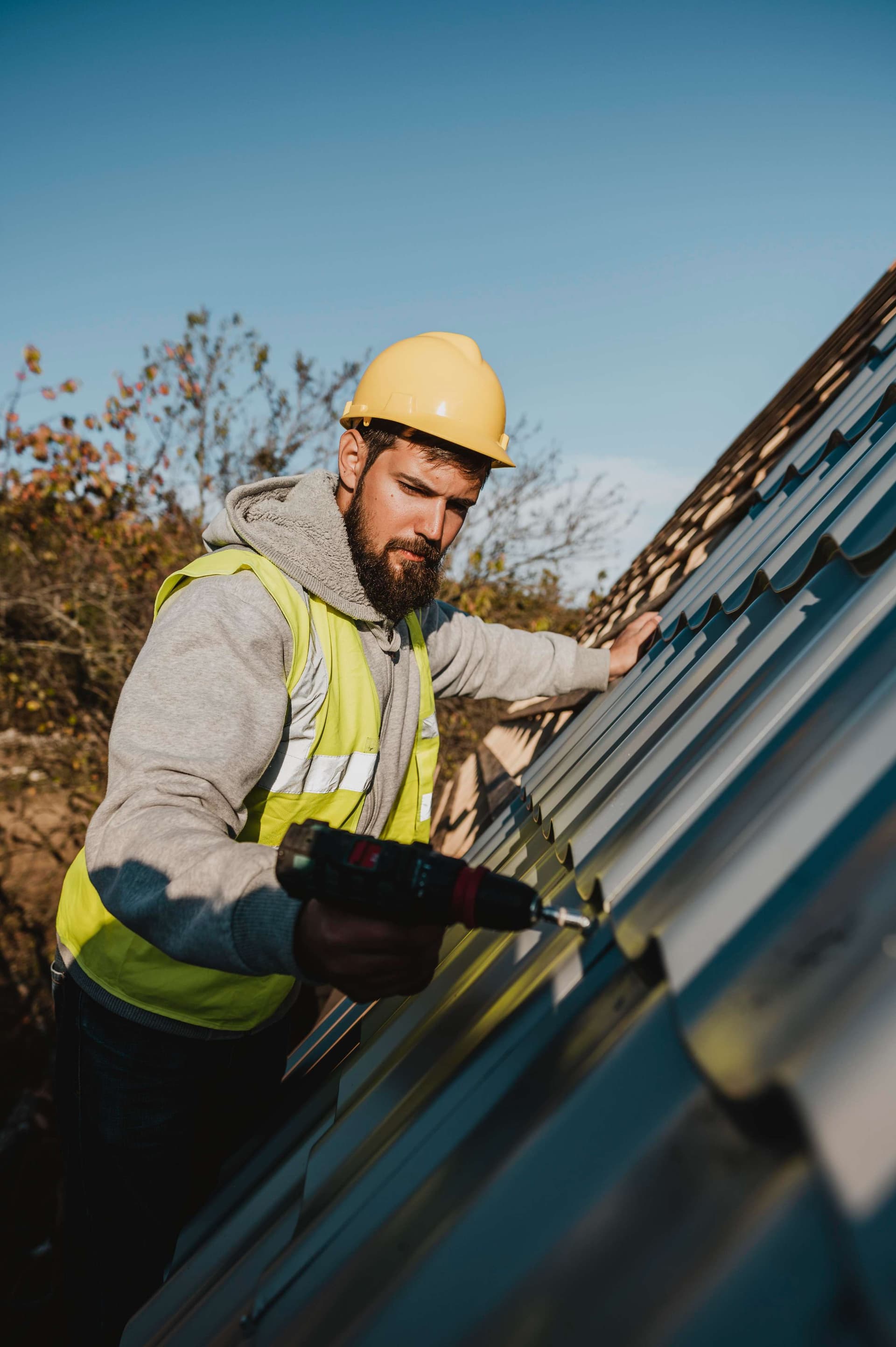 man-working-roof-with-drill